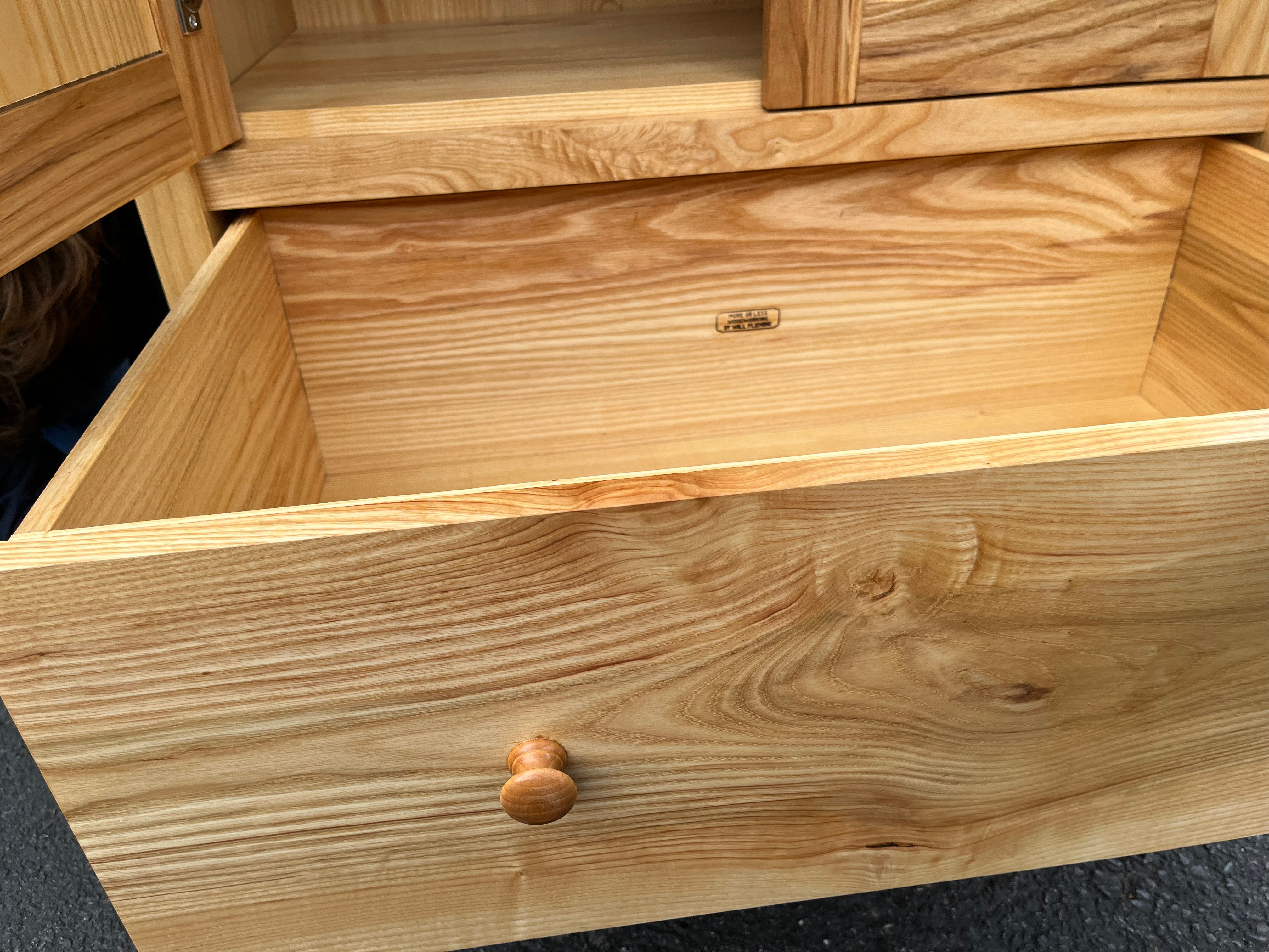 A shaker-style armoire made of ash, close-up of drawer