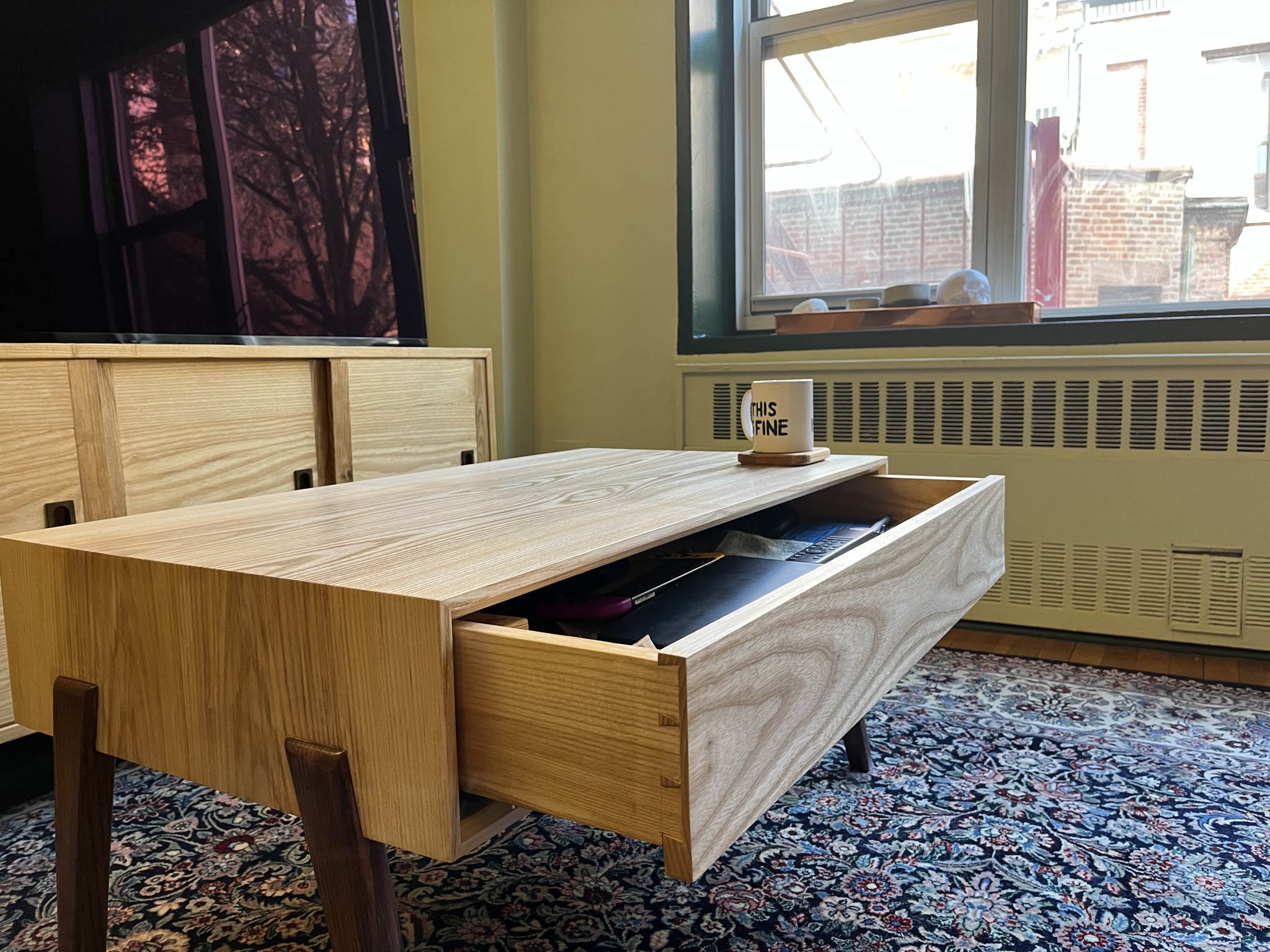 Coffee table made of ash, drawer open